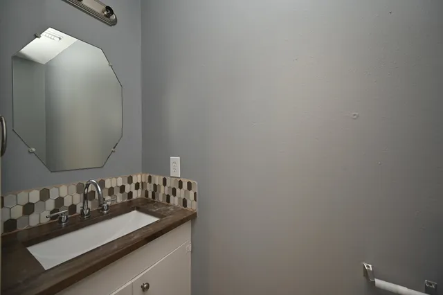 a view of a livingroom with an empty space and a window