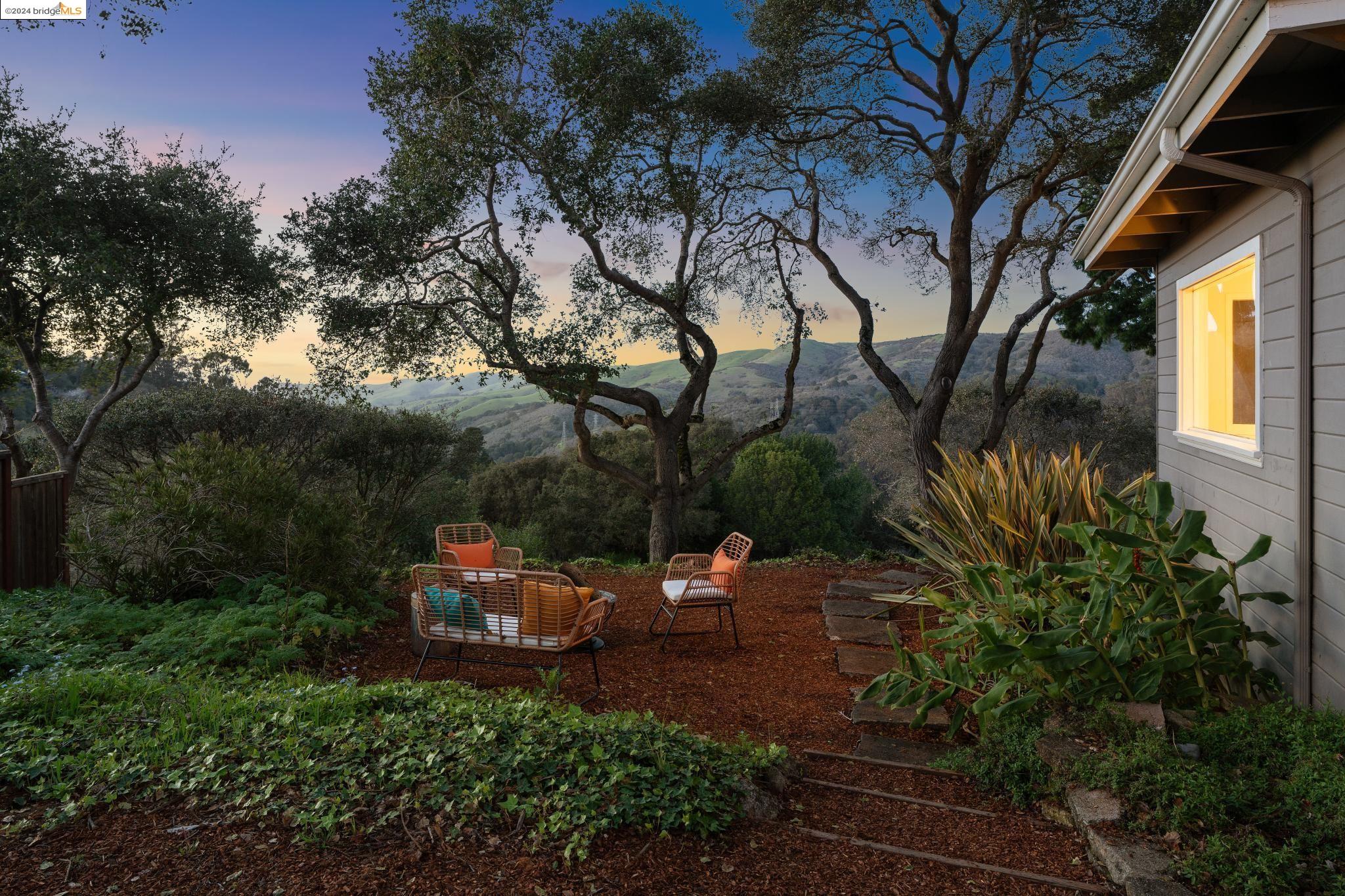 a view of yard with patio