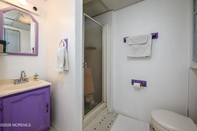 a picture of a bench in front of a wall