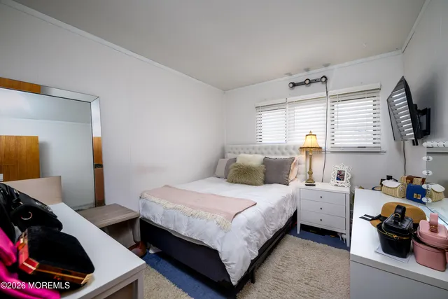 a bathroom with a sink a toilet and shower curtain