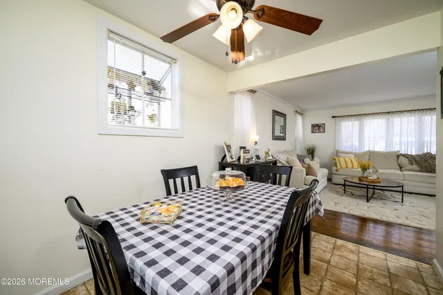 a kitchen view of a dining table chairs and chandelier