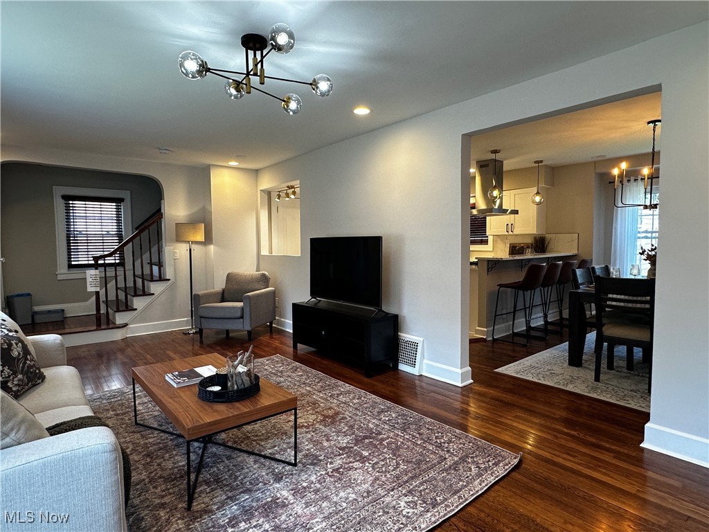 2255 Edgerton Road University Heights, OH 44118 - Photo 13 of 33 Living room with dark hardwood / wood-style flooring and an inviting chandelier