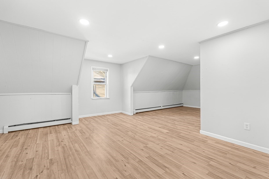 22 Royal Street Boston, MA 02134 - Photo 17 of 42 an empty room with wooden floor and windows
