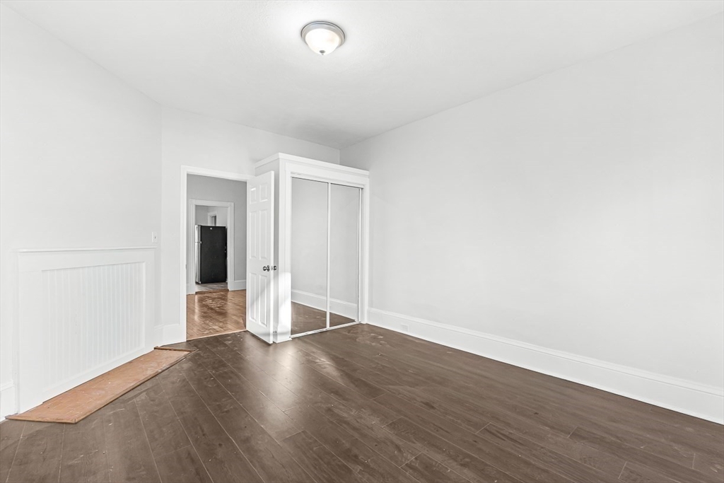 22 Royal Street Boston, MA 02134 - Photo 22 of 42 a view of an empty room with wooden floor