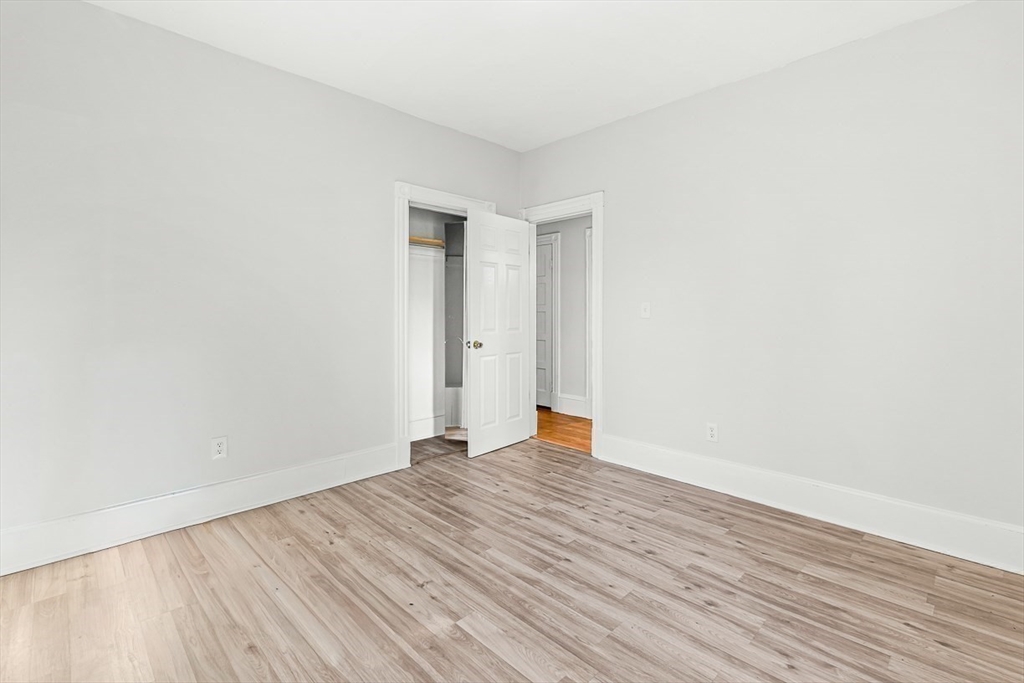 22 Royal Street Boston, MA 02134 - Photo 28 of 42 a view of an empty room with wooden floor