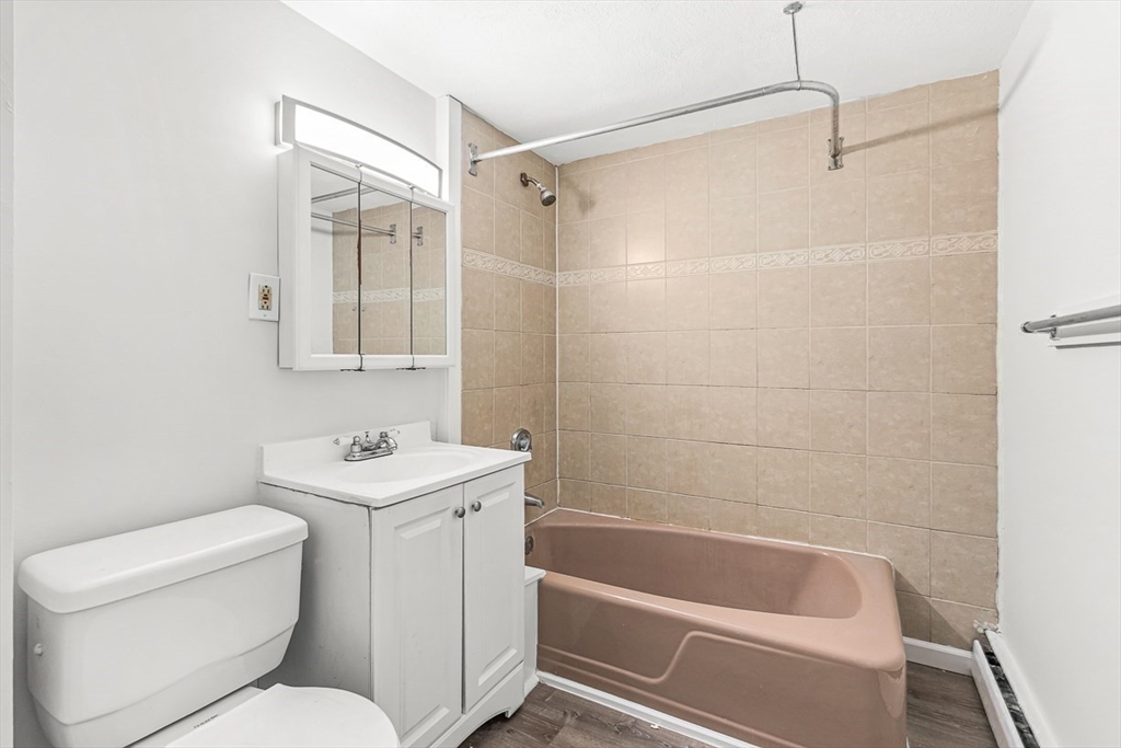 22 Royal Street Boston, MA 02134 - Photo 29 of 42 a bathroom with a toilet a sink and bathtub