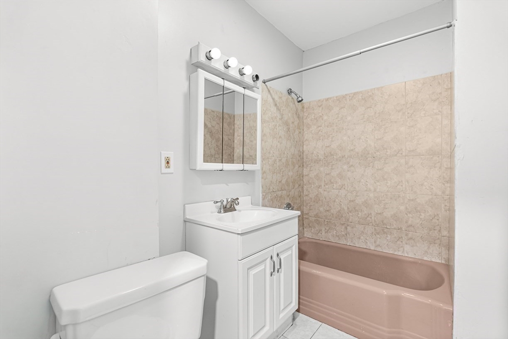 22 Royal Street Boston, MA 02134 - Photo 35 of 42 a bathroom with a sink a toilet and shower
