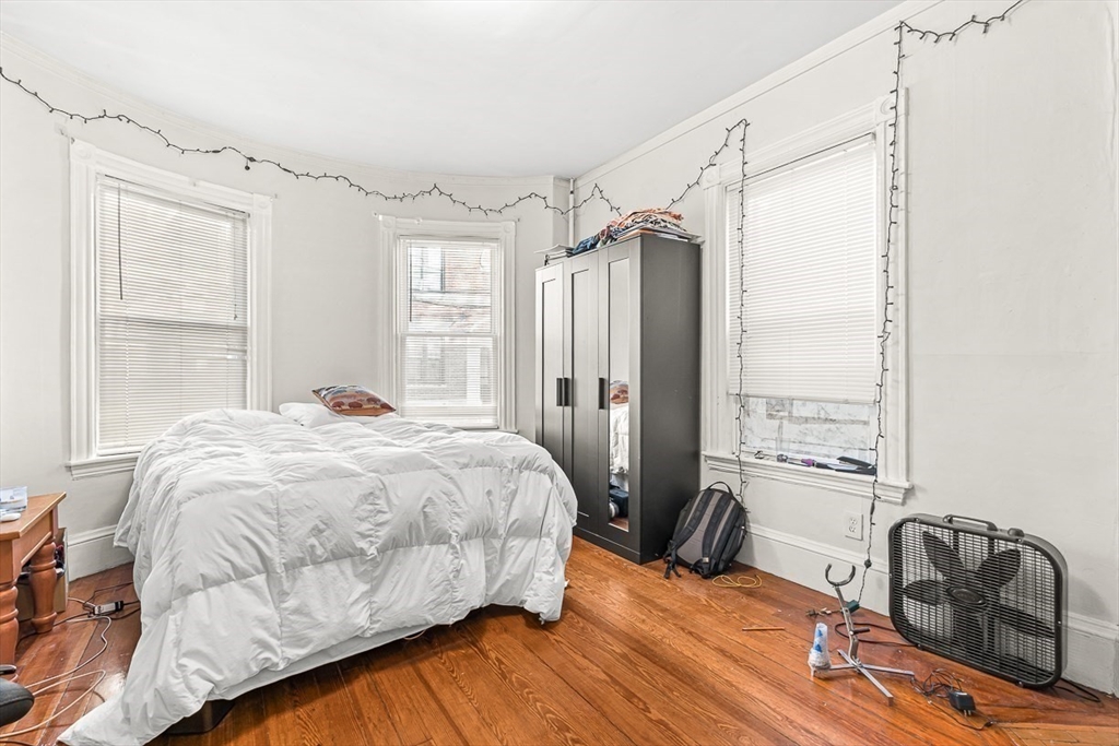 22 Royal Street Boston, MA 02134 - Photo 5 of 42 a bedroom with a bed and a window