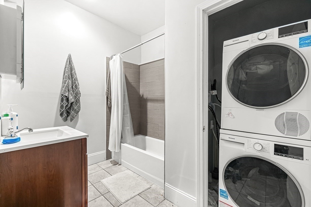 22 Royal Street Boston, MA 02134 - Photo 8 of 42 a bathroom with a sink a washer and dryer