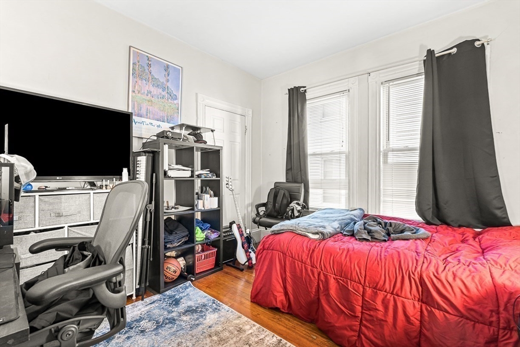 22 Royal Street Boston, MA 02134 - Photo 9 of 42 a bedroom with a bed and a flat screen tv