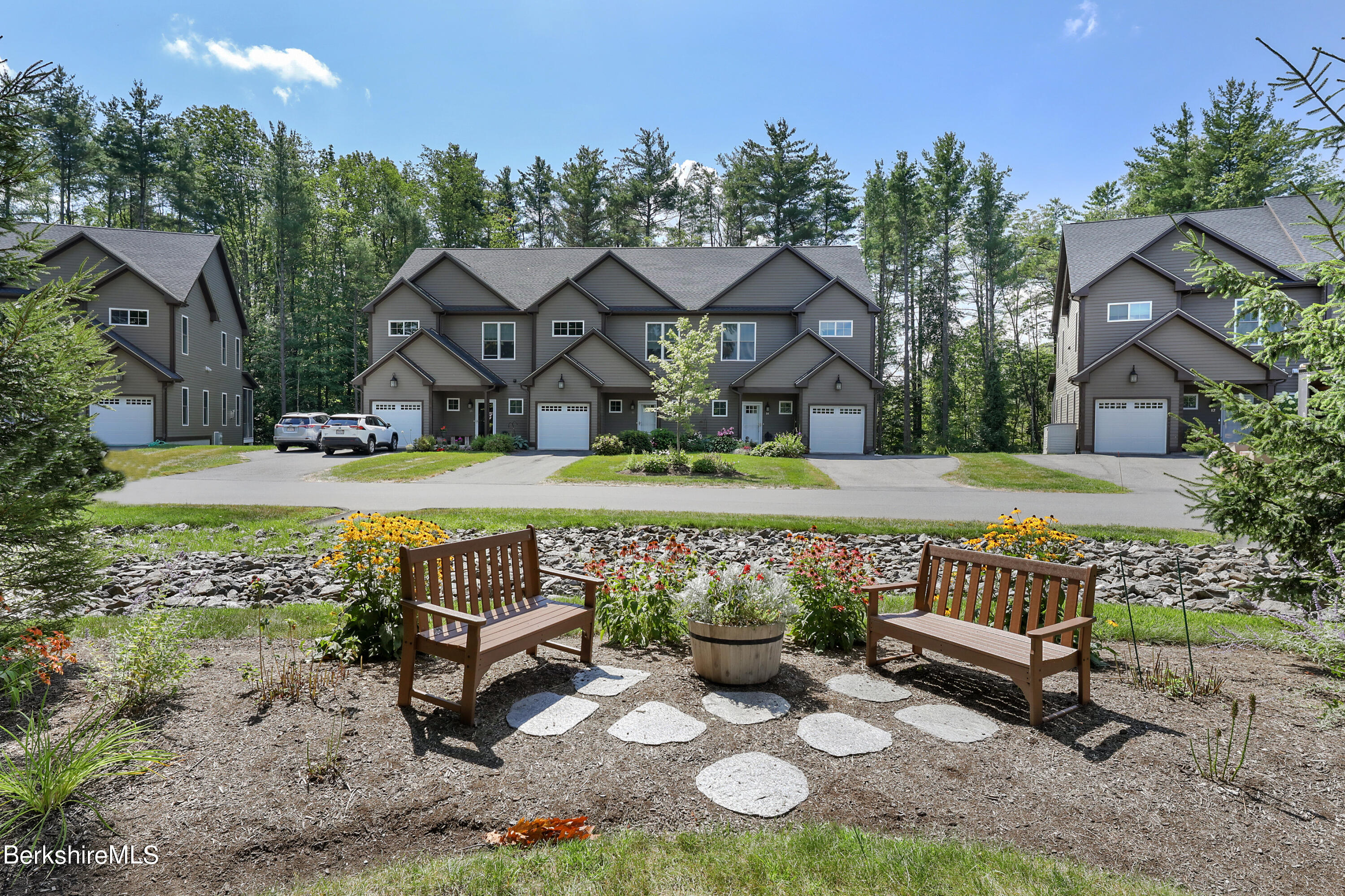 16 Spruce Trail, Unit 16 Lenox, MA 01240 - Photo 1 of 33 a view of a house with a yard patio and outdoor seating