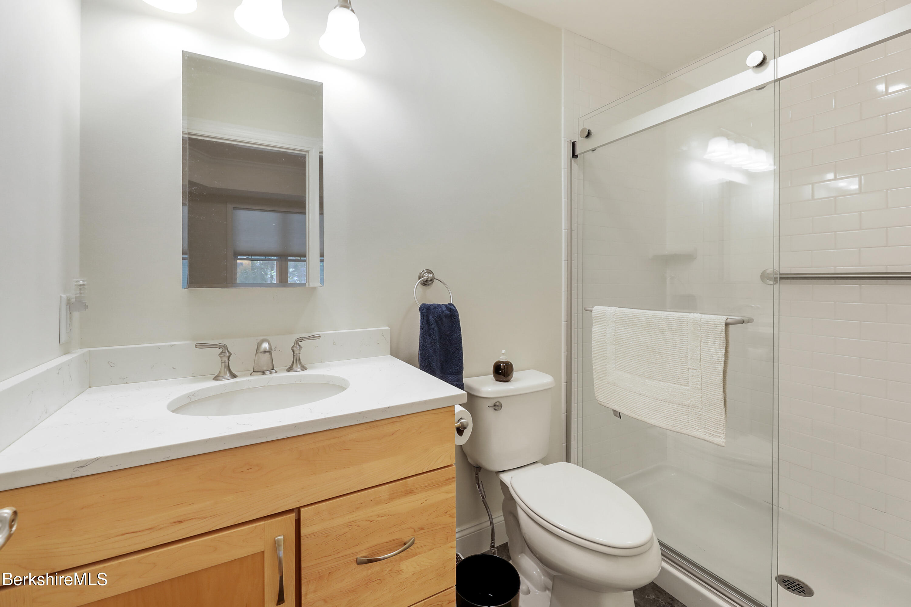 16 Spruce Trail, Unit 16 Lenox, MA 01240 - Photo 14 of 33 a bathroom with a sink toilet vanity and shower