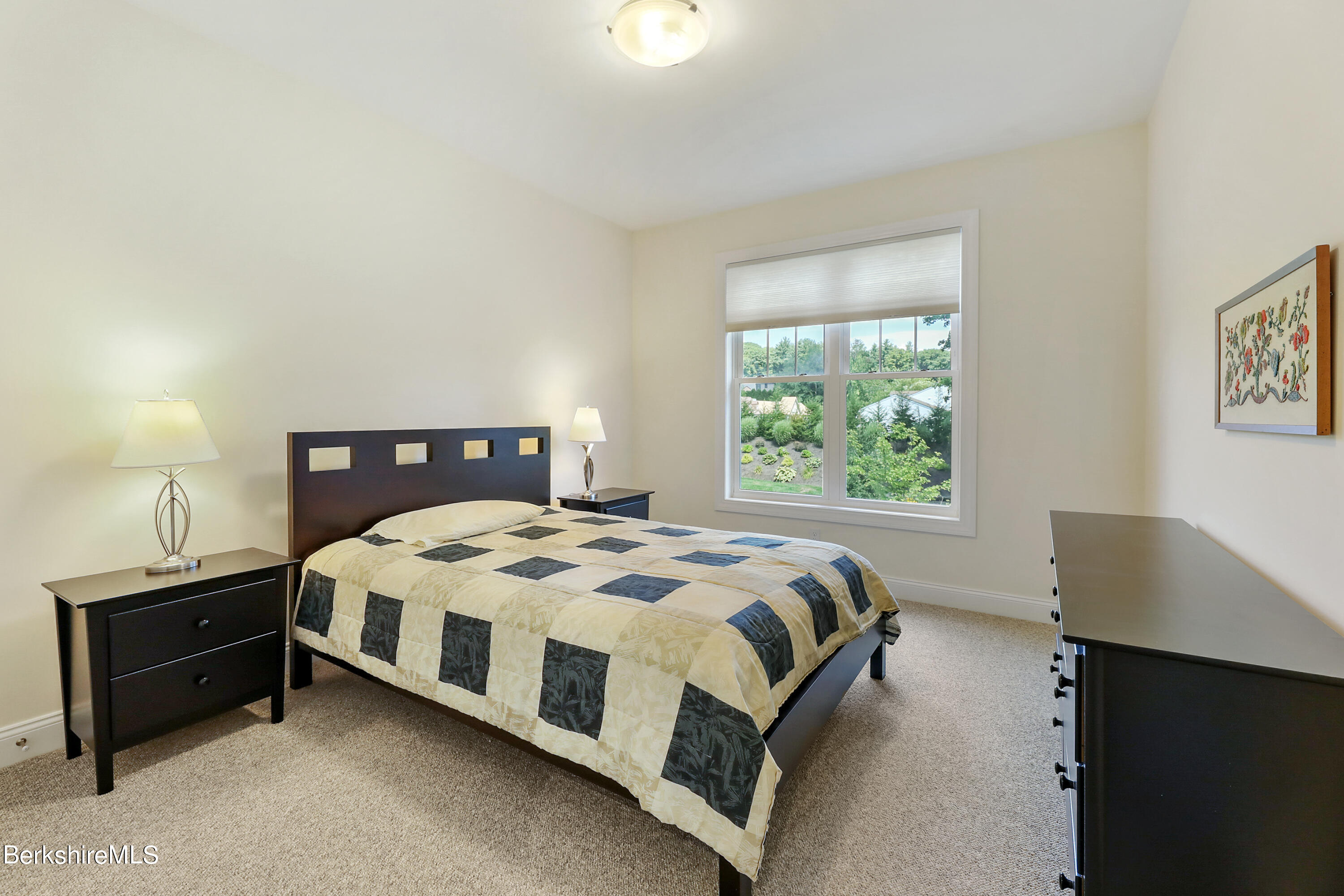 16 Spruce Trail, Unit 16 Lenox, MA 01240 - Photo 18 of 33 a bedroom with a bed and window