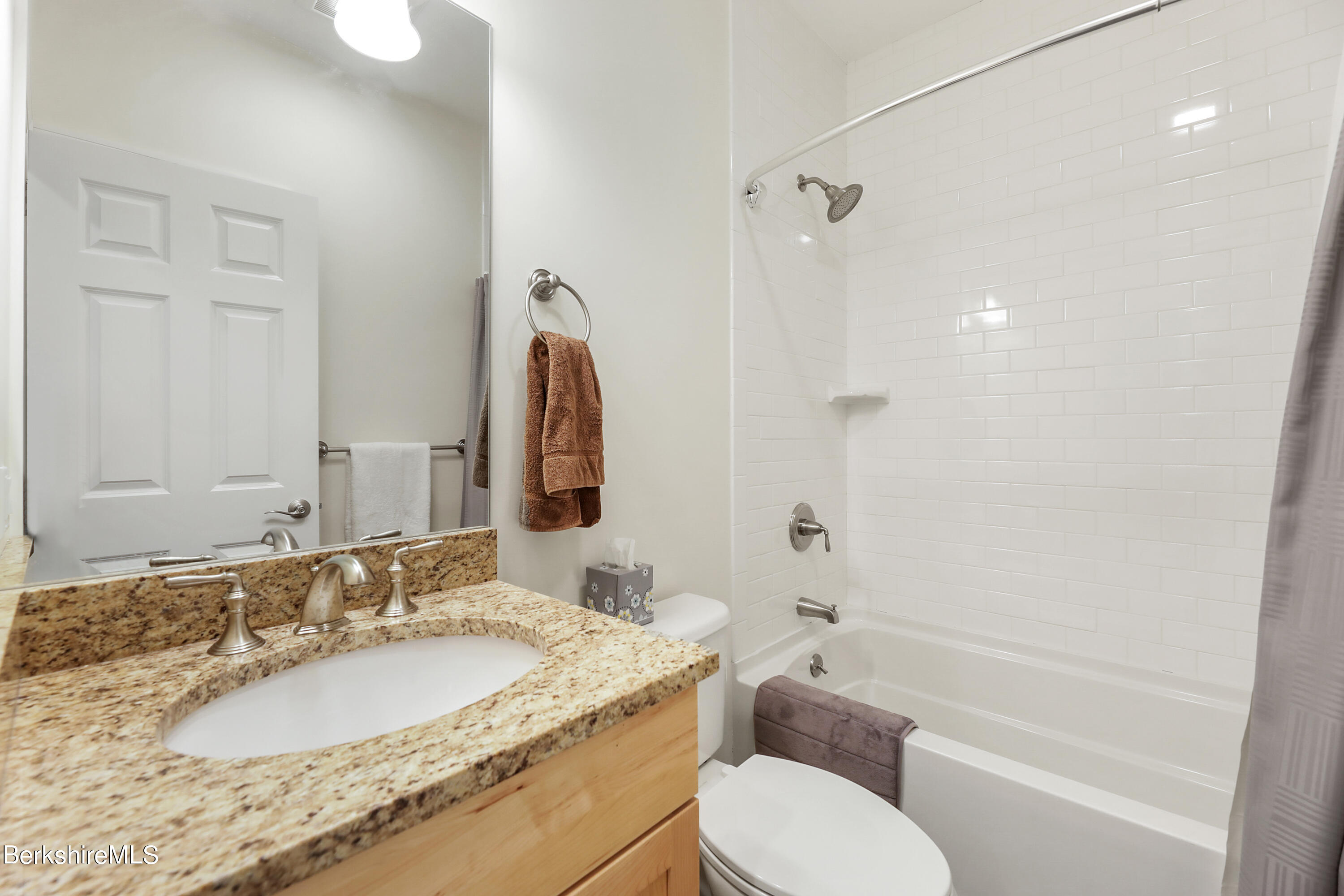 16 Spruce Trail, Unit 16 Lenox, MA 01240 - Photo 22 of 33 a bathroom with a granite countertop sink toilet and shower