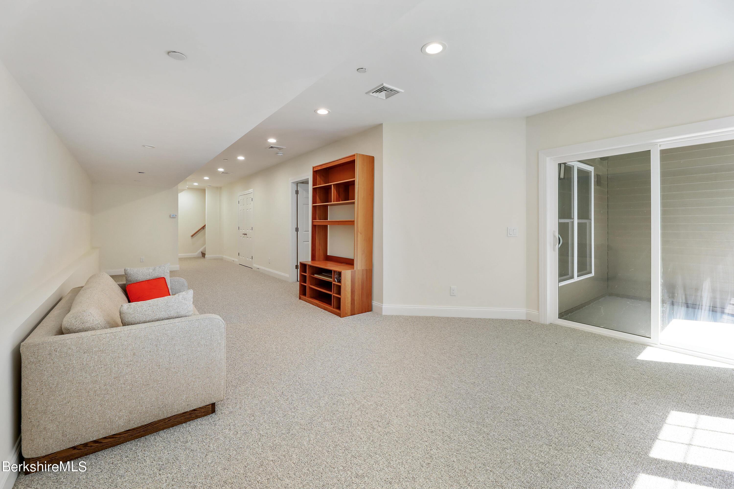 16 Spruce Trail, Unit 16 Lenox, MA 01240 - Photo 25 of 33 a living room with furniture and a table