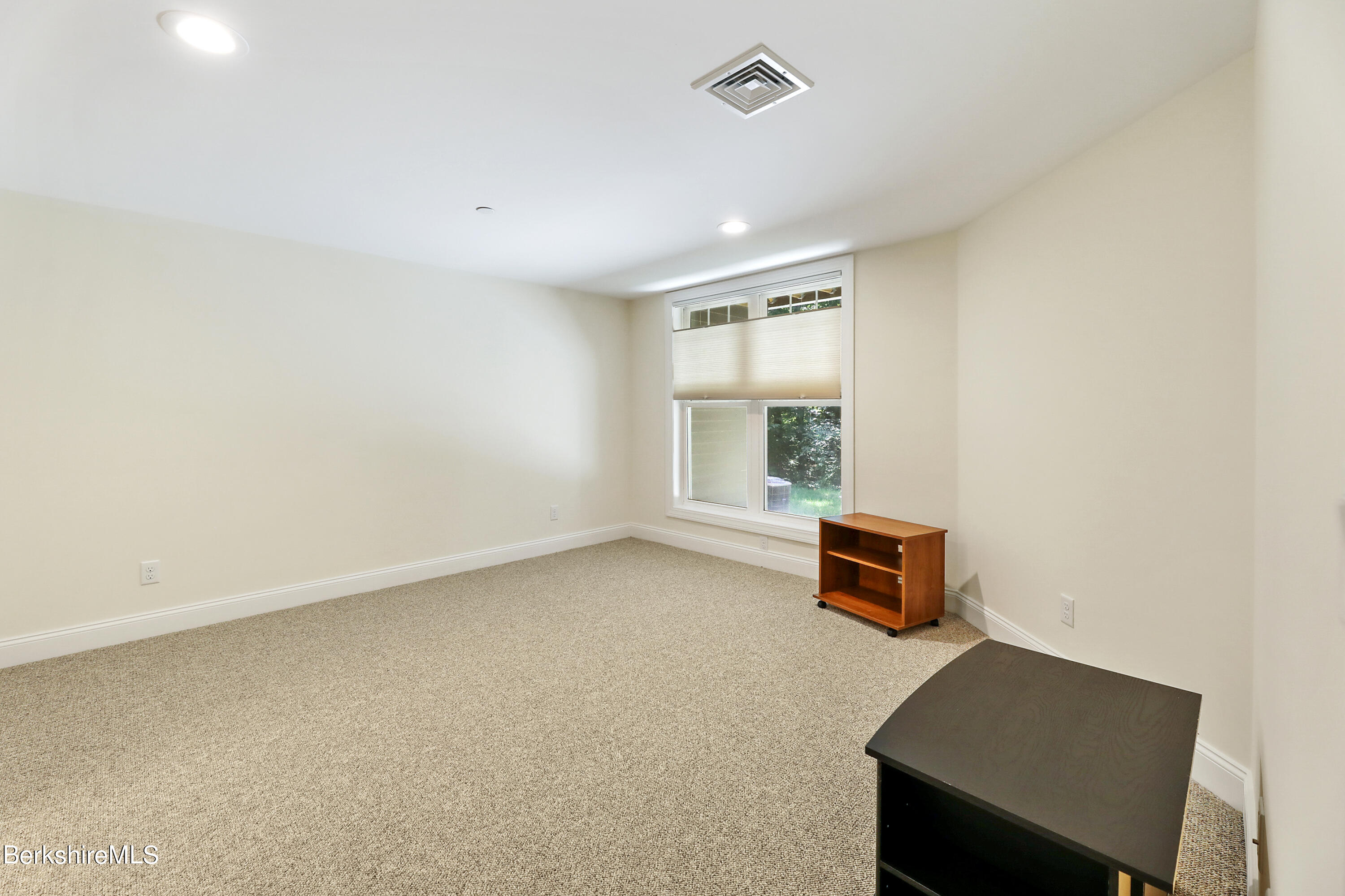 16 Spruce Trail, Unit 16 Lenox, MA 01240 - Photo 29 of 33 an empty room with a window