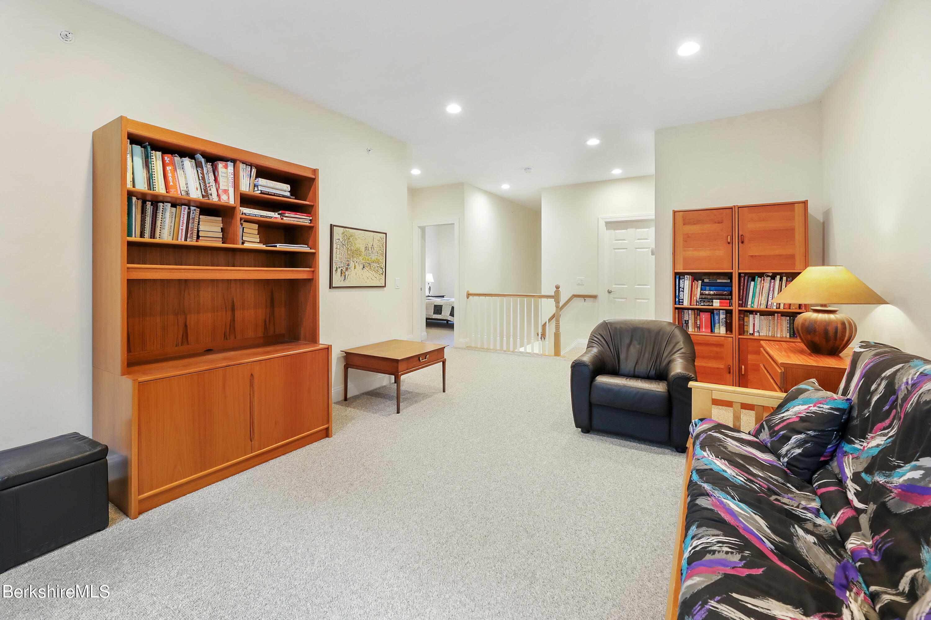 16 Spruce Trail, Unit 16 Lenox, MA 01240 - Photo 31 of 33 a living room with furniture a rug and a window