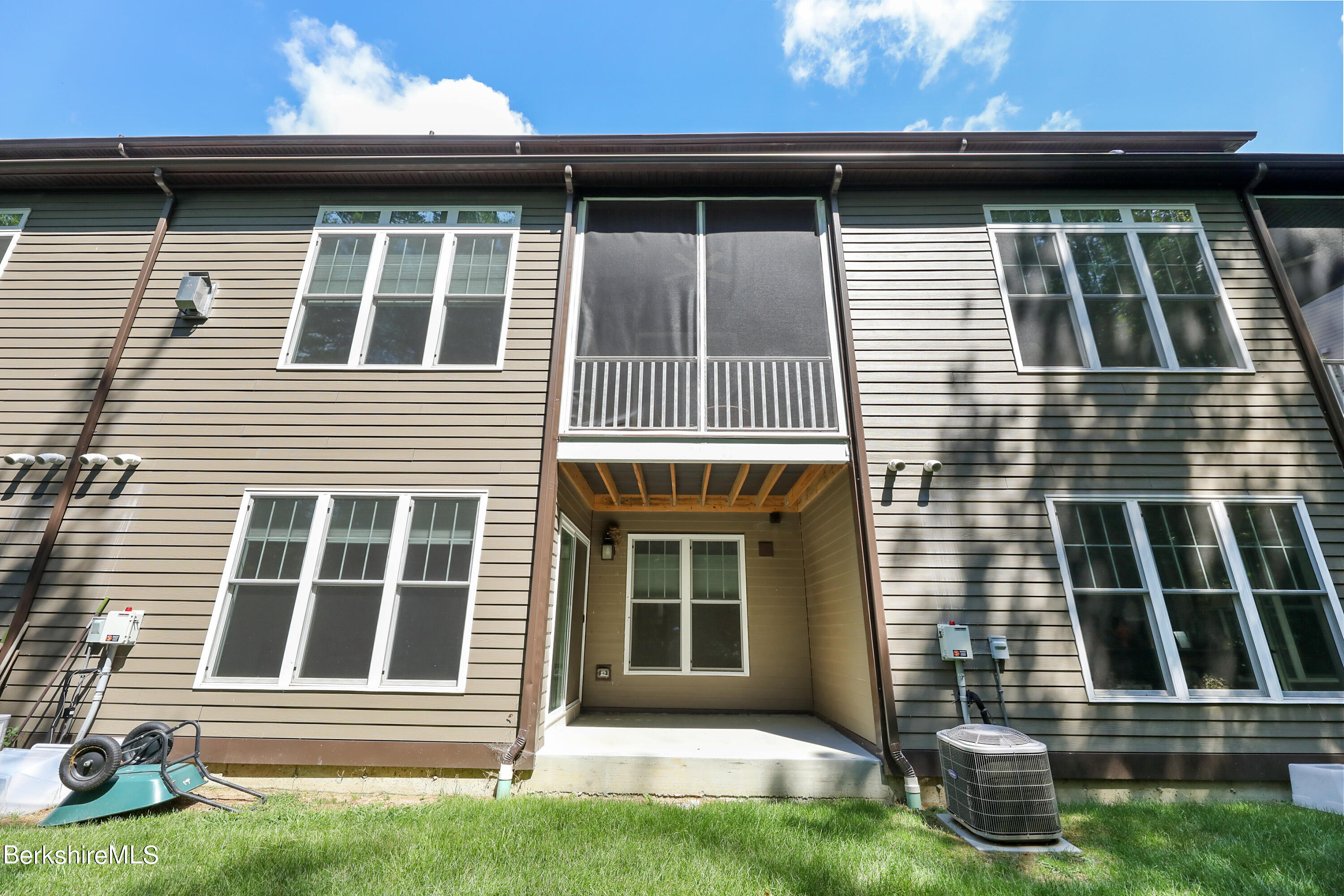 16 Spruce Trail, Unit 16 Lenox, MA 01240 - Photo 33 of 33 a front view of a house with a yard