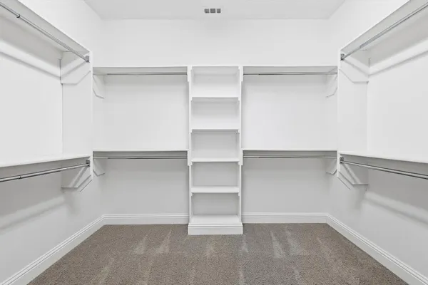 a view of an empty walk in closet