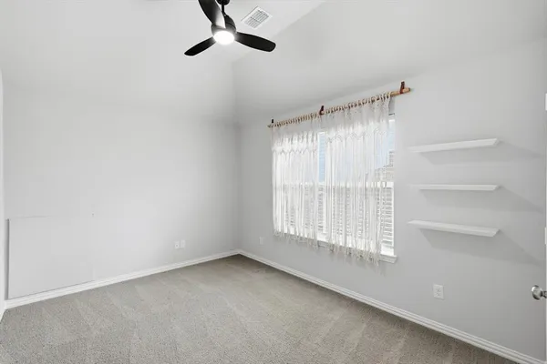 an empty room with a empty space and windows