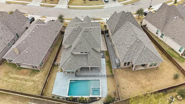 an aerial view of residential houses with outdoor space