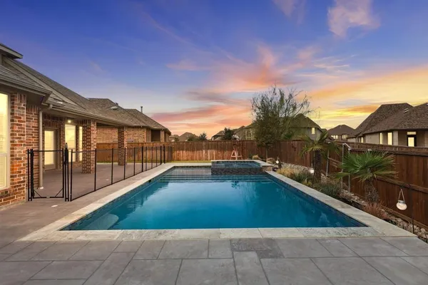 a view of swimming pool with lounge chair