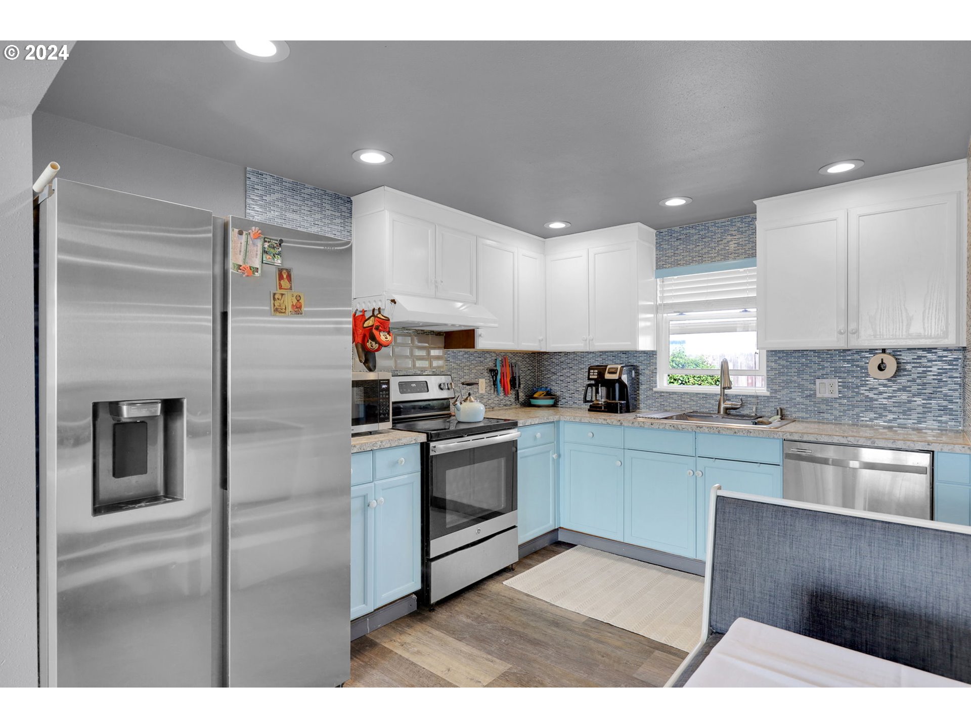 155 South 71st Street Springfield, OR 97478 - Photo 19 of 45 a kitchen with cabinets and stainless steel appliances
