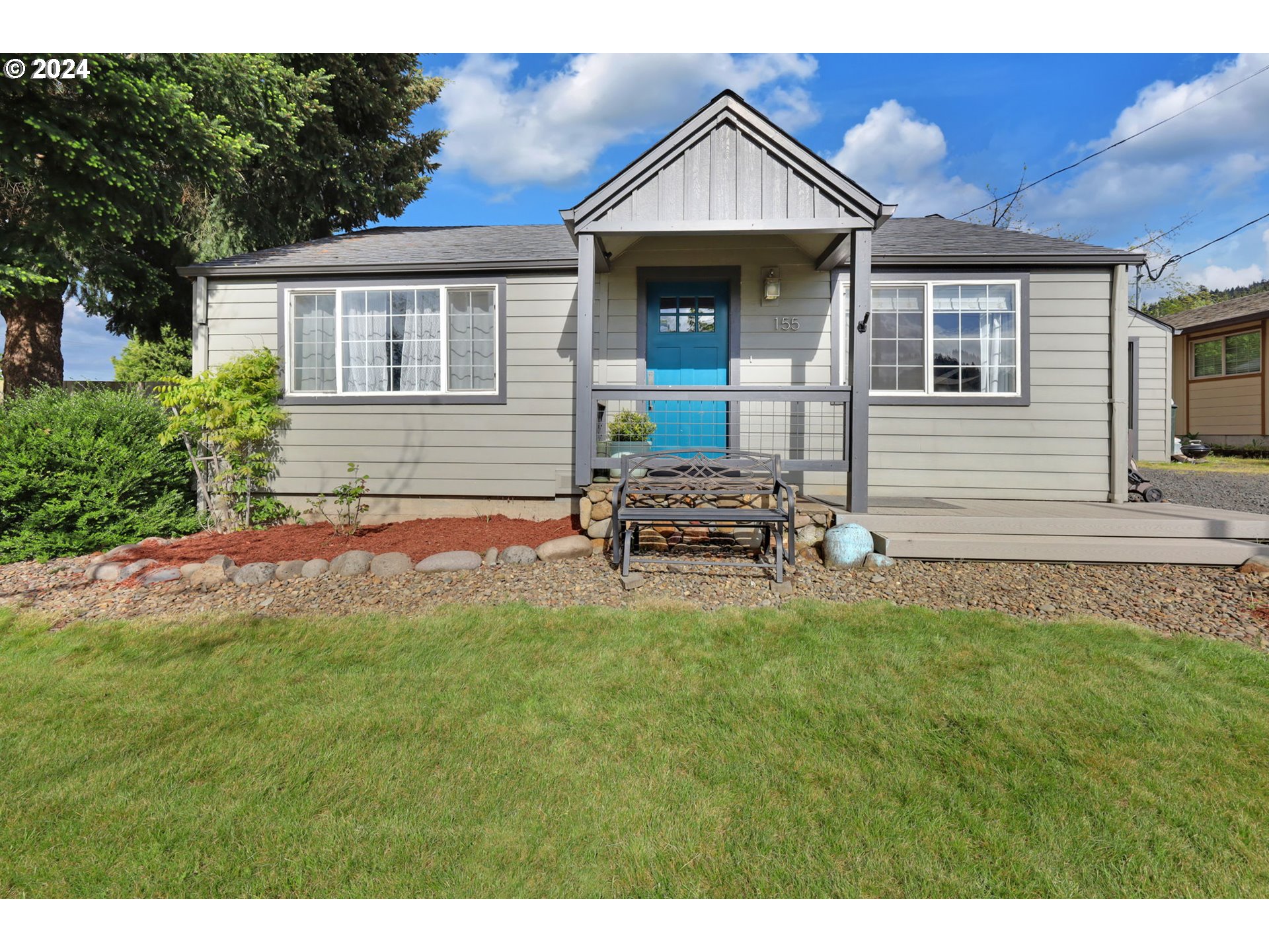 155 South 71st Street Springfield, OR 97478 - Photo 2 of 45 a front view of a house with a yard
