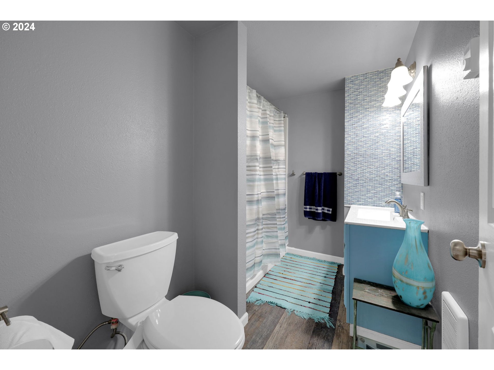 155 South 71st Street Springfield, OR 97478 - Photo 28 of 45 a bathroom with a toilet a sink and mirror