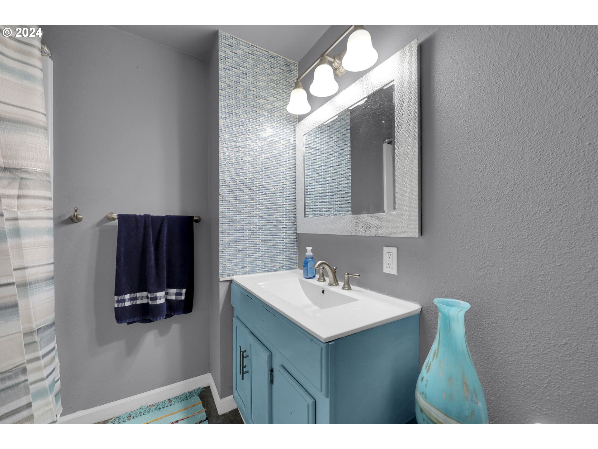 155 South 71st Street Springfield, OR 97478 - Photo 30 of 45 a bathroom with a sink vanity and mirror