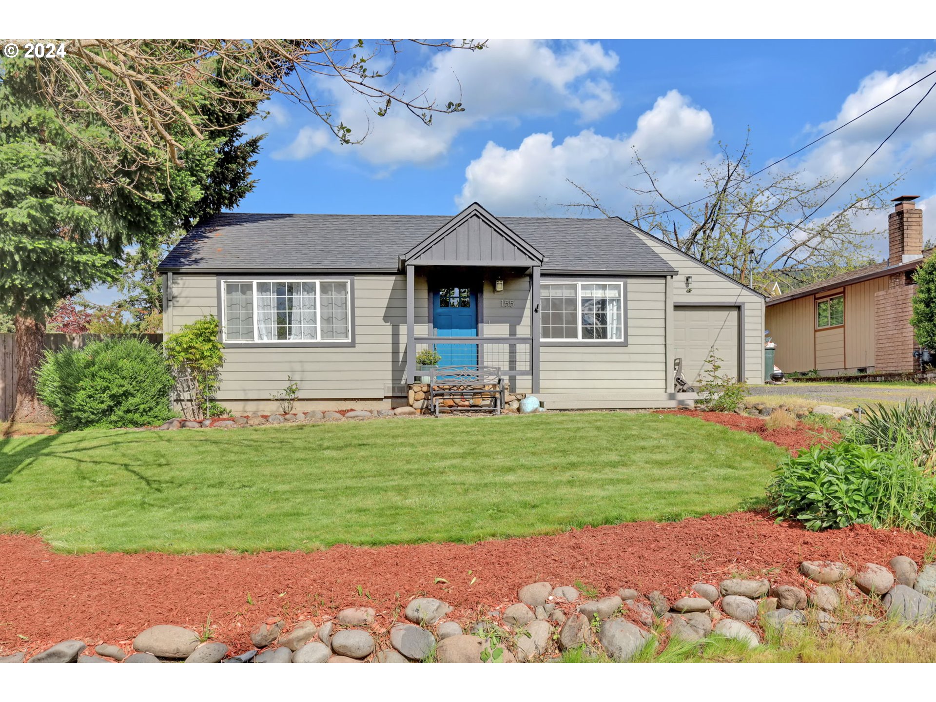 155 South 71st Street Springfield, OR 97478 - Photo 3 of 45 a front view of a house with a garden