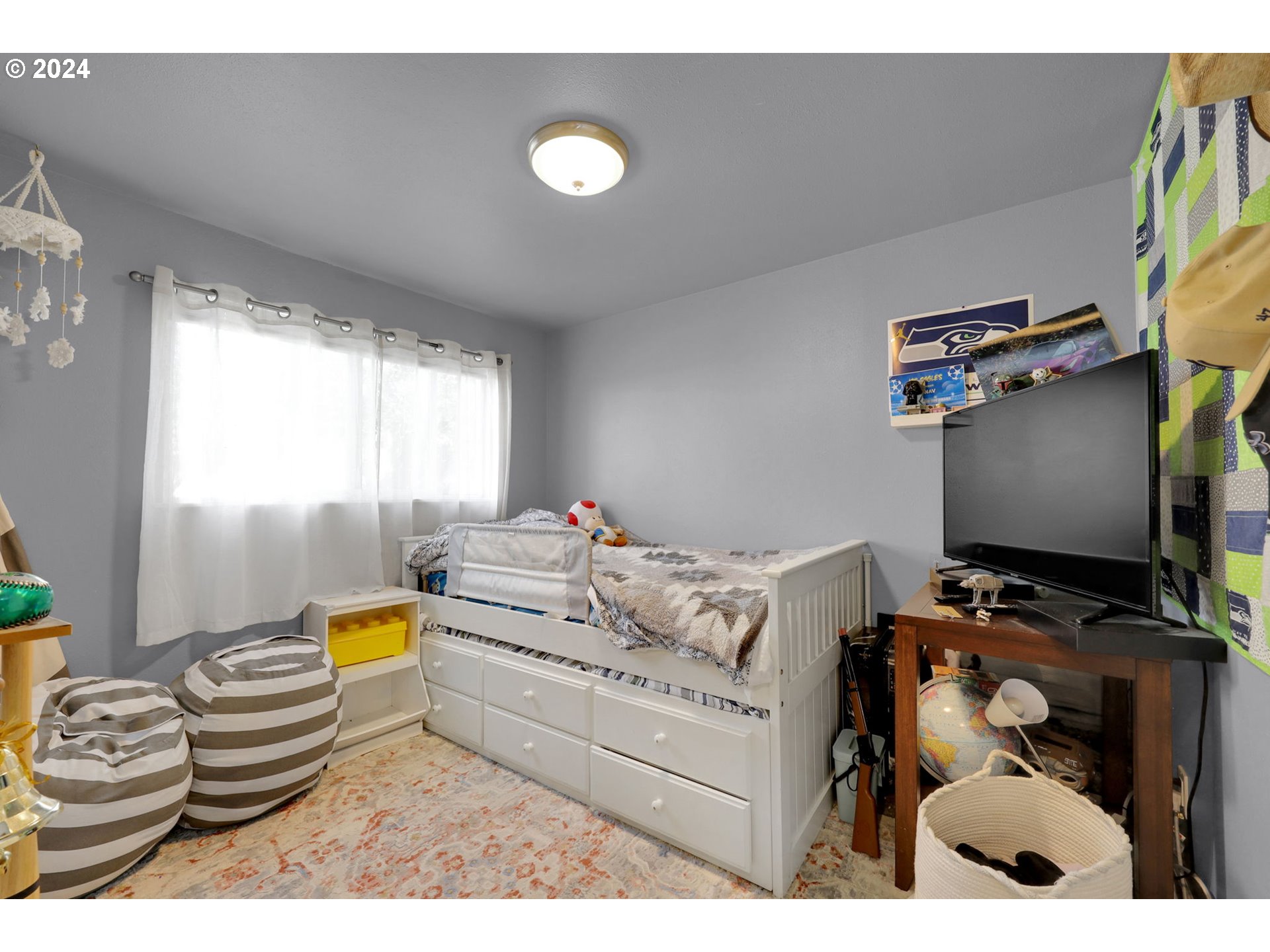 155 South 71st Street Springfield, OR 97478 - Photo 31 of 45 a bedroom with a bed and a window