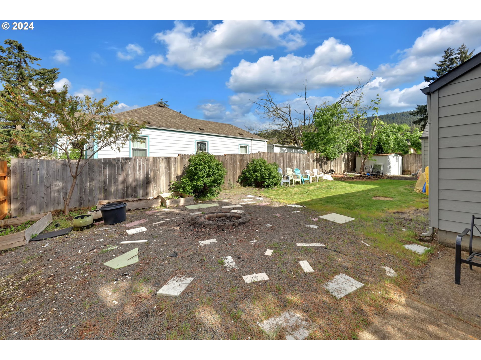 155 South 71st Street Springfield, OR 97478 - Photo 36 of 45 a backyard of a house with table and chairs