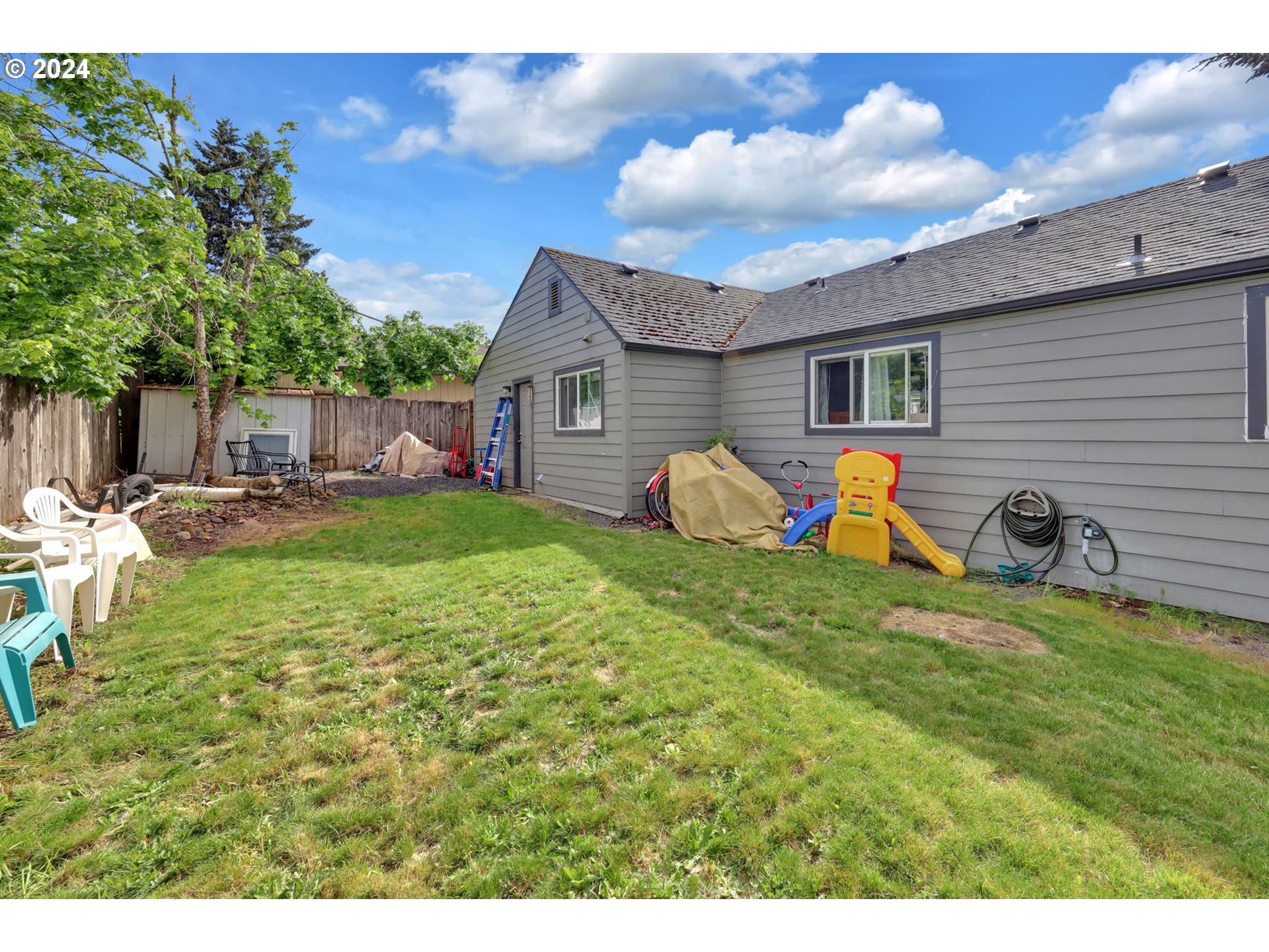 155 South 71st Street Springfield, OR 97478 - Photo 38 of 45 a view of a house with backyard and sitting area