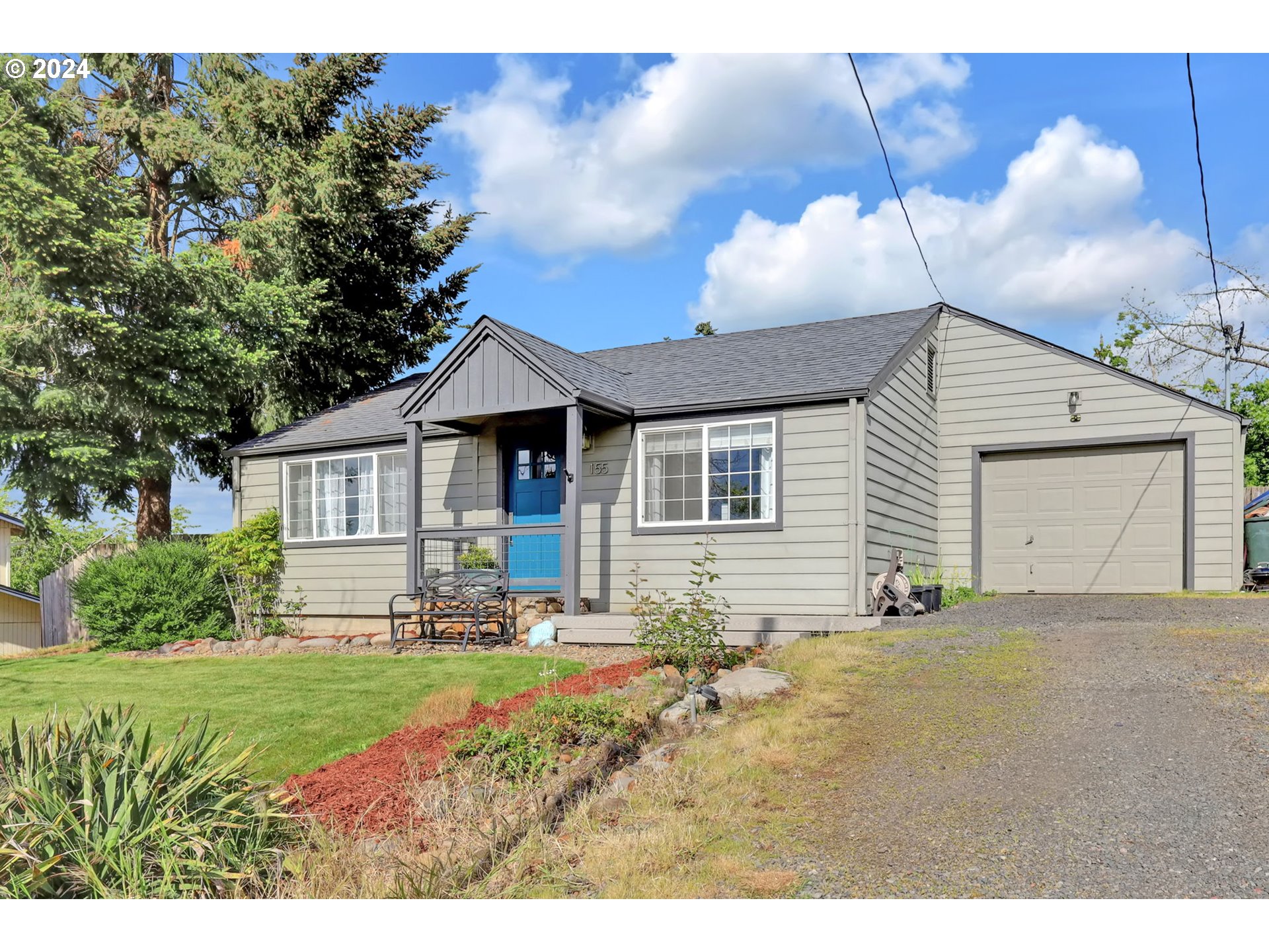 155 South 71st Street Springfield, OR 97478 - Photo 5 of 45 a front view of a house with garden