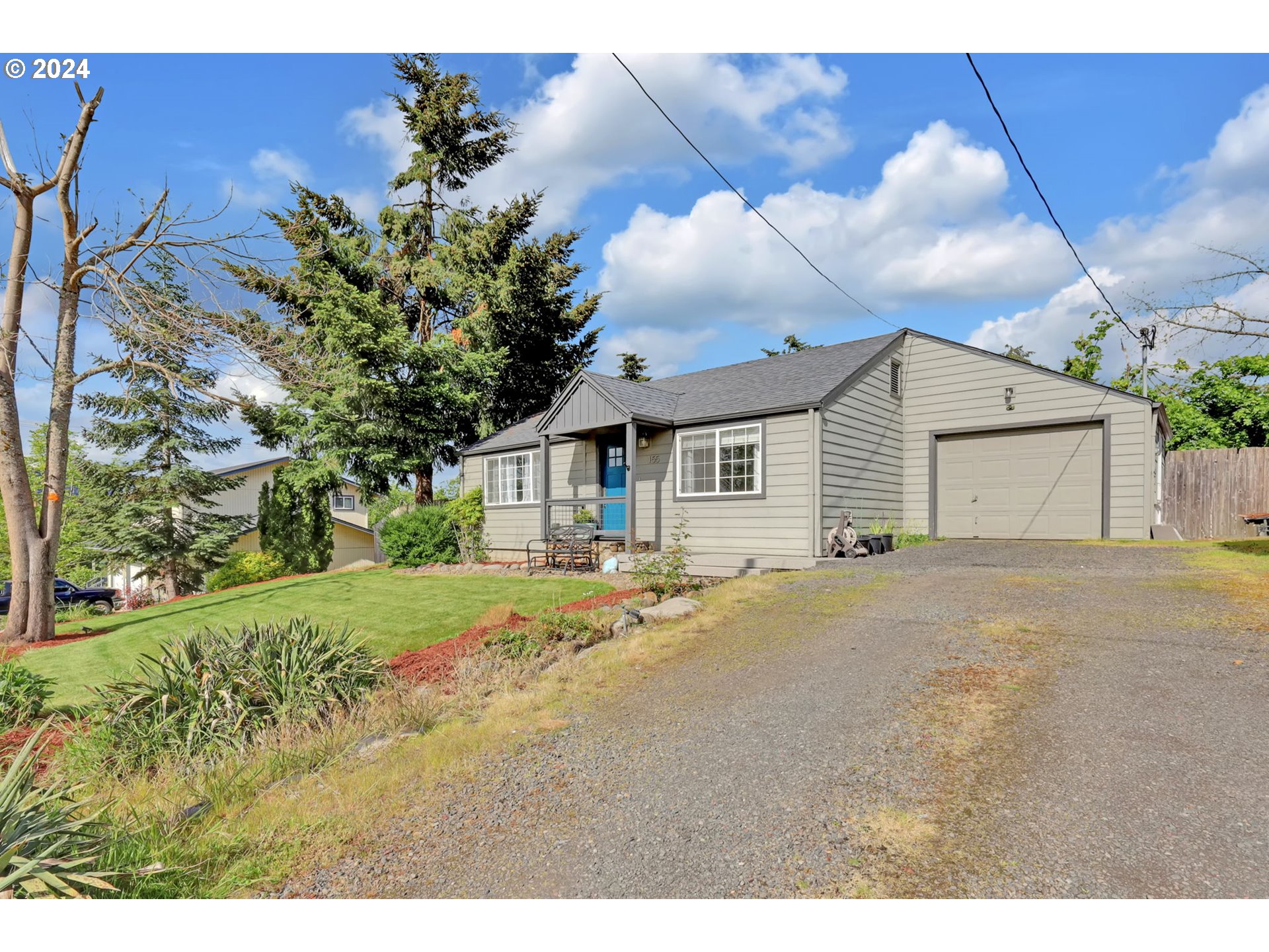 155 South 71st Street Springfield, OR 97478 - Photo 7 of 45 a view of a house with a yard and garage