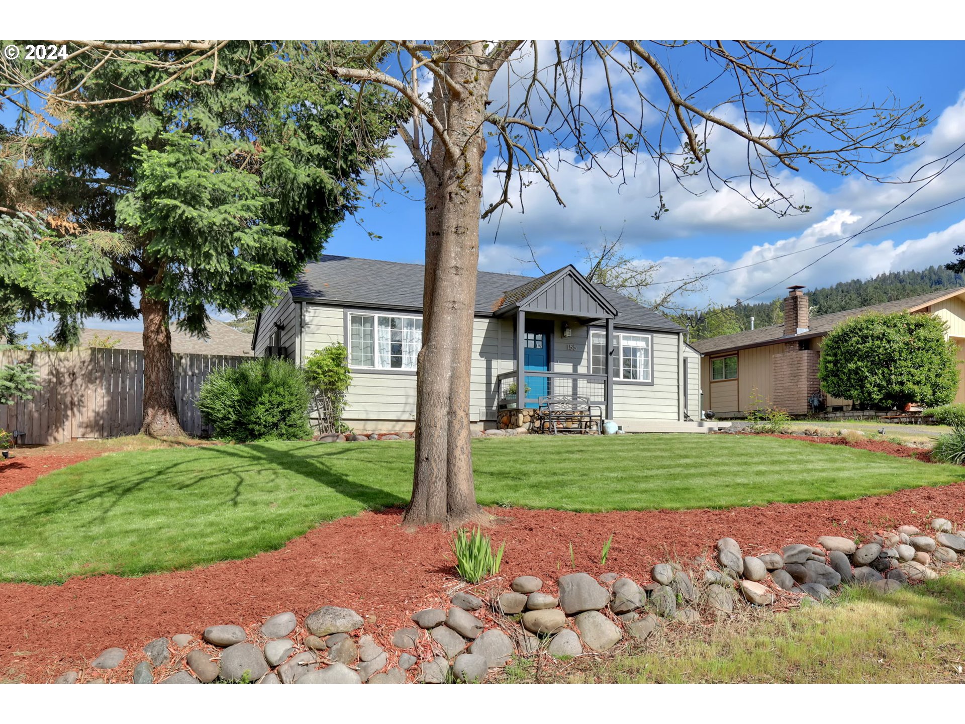 155 South 71st Street Springfield, OR 97478 - Photo 8 of 45 a front view of a house with a garden
