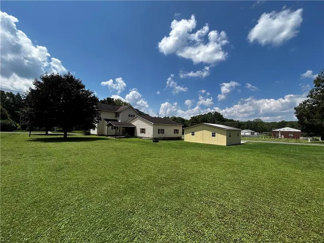 a night view of a house with a big yard