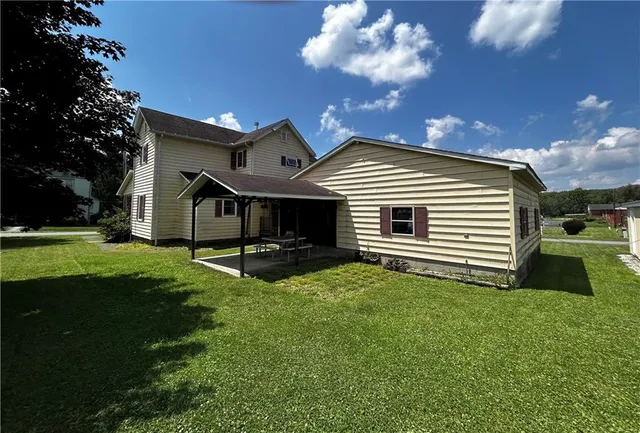 a front view of a house with a yard