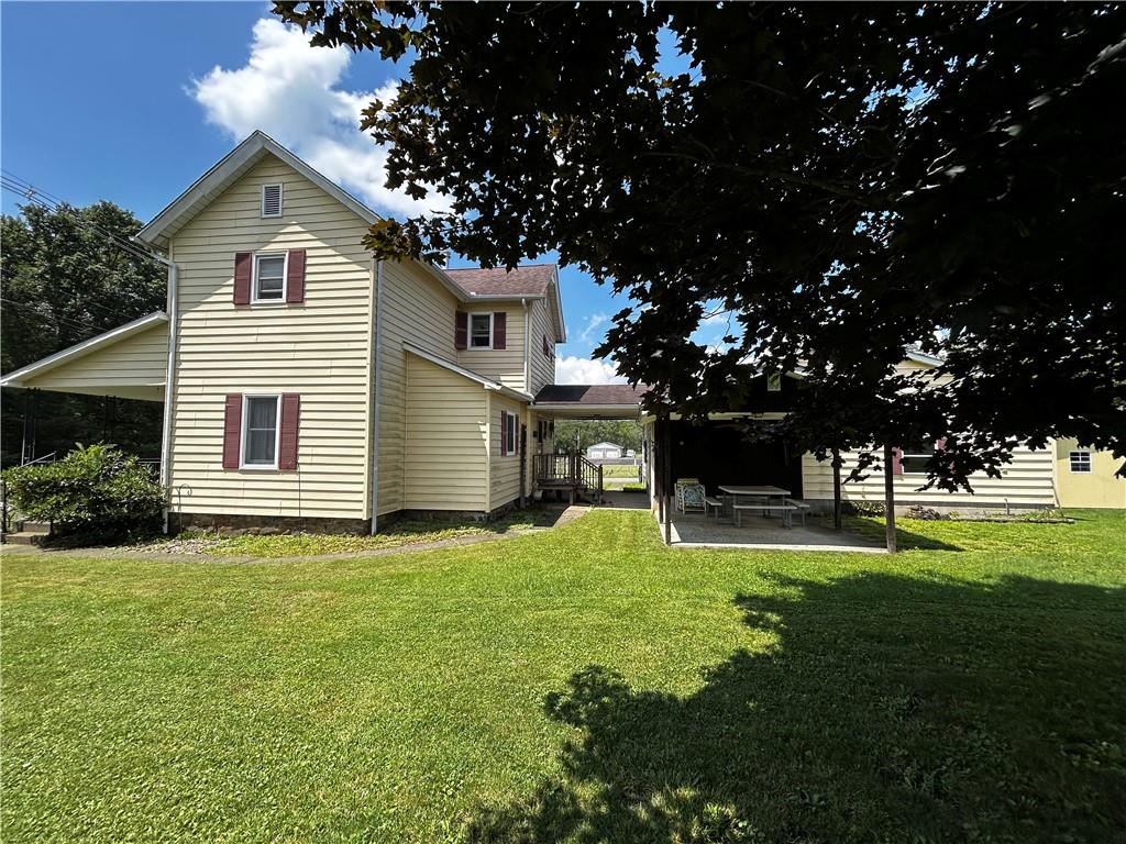 171 9th Street New Florence, PA 15944 - Photo 5 of 18 a front view of a house with a garden