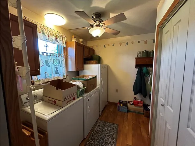 a kitchen that has a sink a stove and a refrigerator
