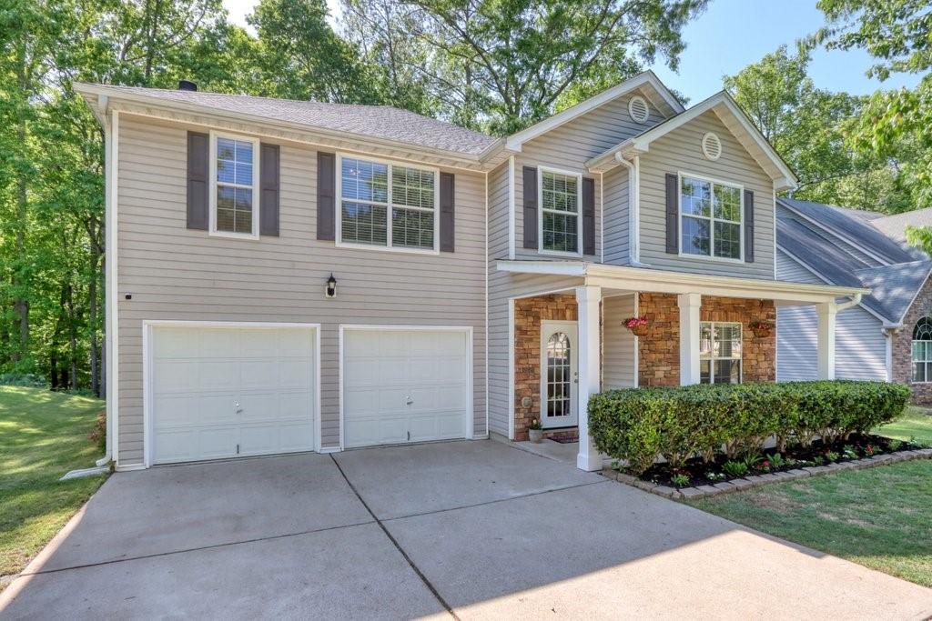 127 Randy Way Dallas, GA 30132 - Photo 1 of 1 a front view of a house with a garden