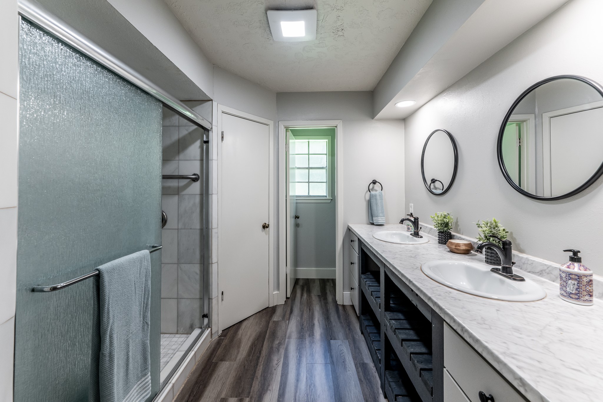 92 A Mt Zion Road New Waverly, TX 77358 - Photo 12 of 29 a bathroom with a granite countertop double vanity sink and a mirror