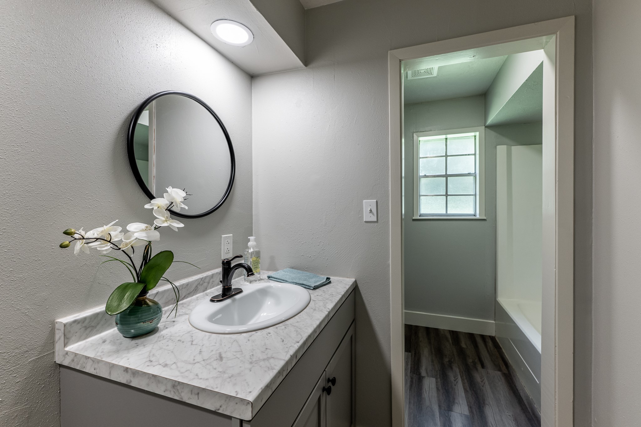 92 A Mt Zion Road New Waverly, TX 77358 - Photo 14 of 29 a bathroom with a granite countertop sink and a mirror