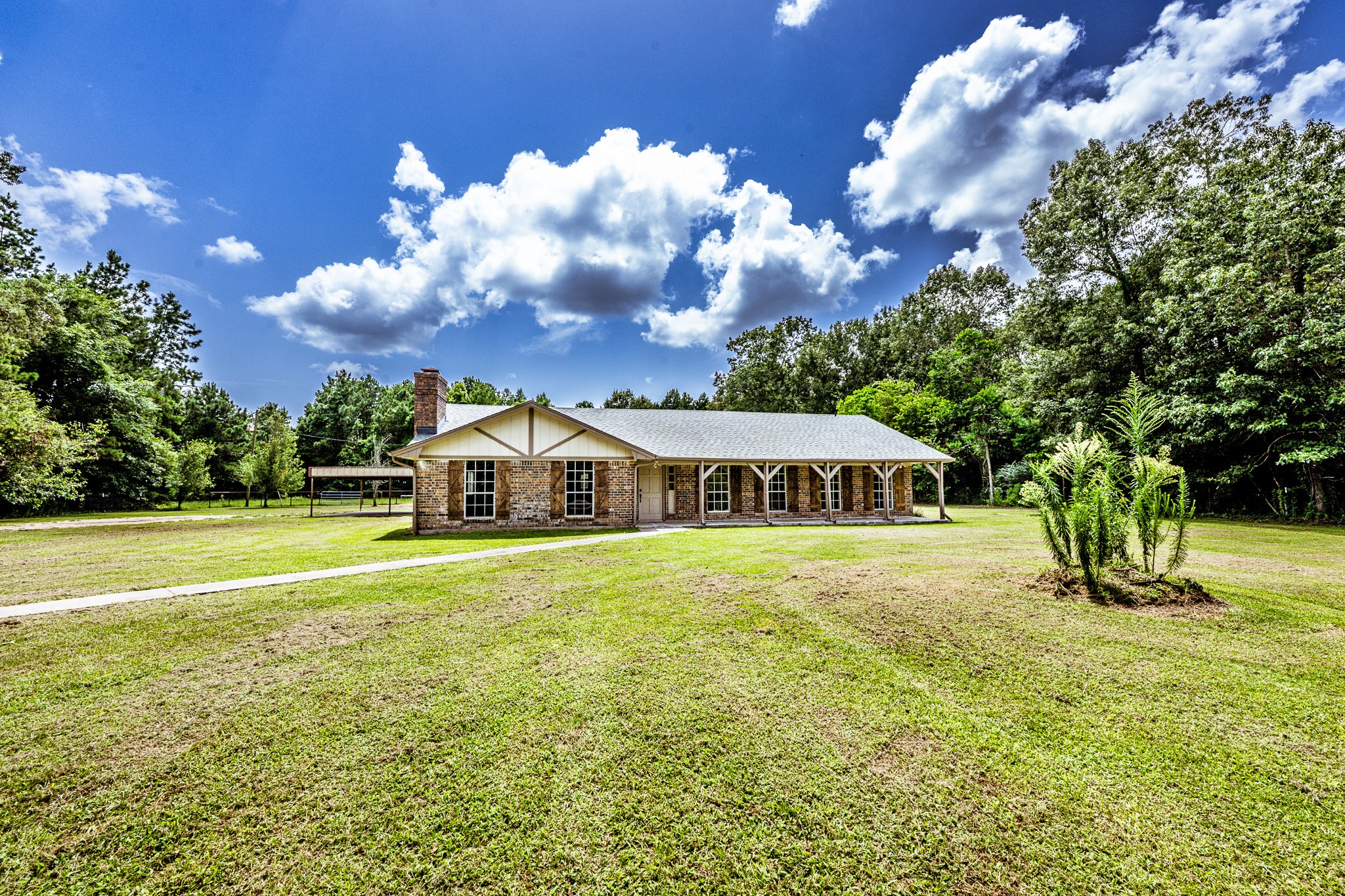 92 A Mt Zion Road New Waverly, TX 77358 - Photo 3 of 29 a front view of a house with a yard