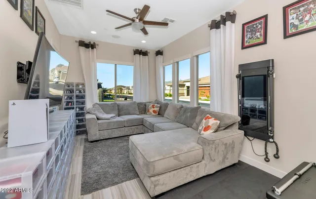 a living room with furniture and a large window