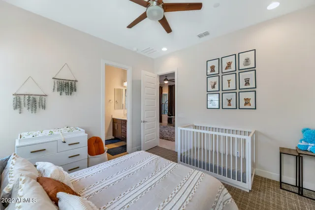 a bedroom with furniture and a window