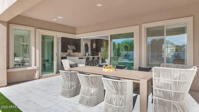 a dining room with furniture wooden floor and a potted plant