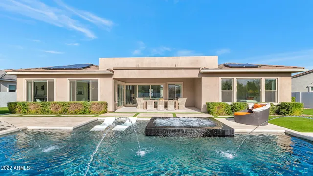 a front view of a house with garden and porch