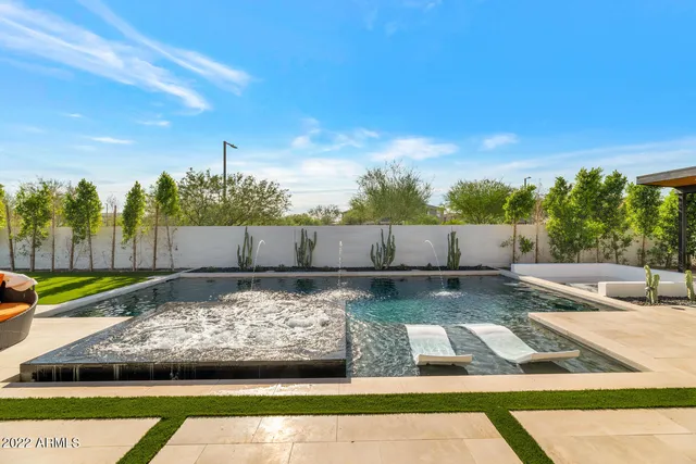 a view of swimming pool with seating
